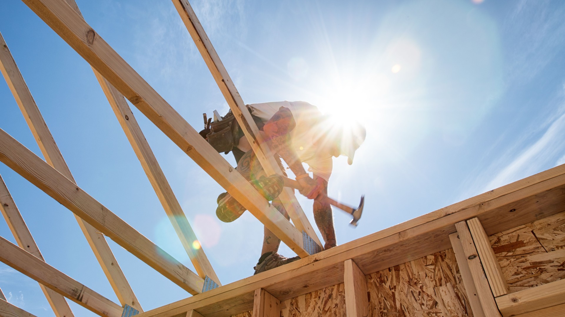 Construction Worker Framing A Building